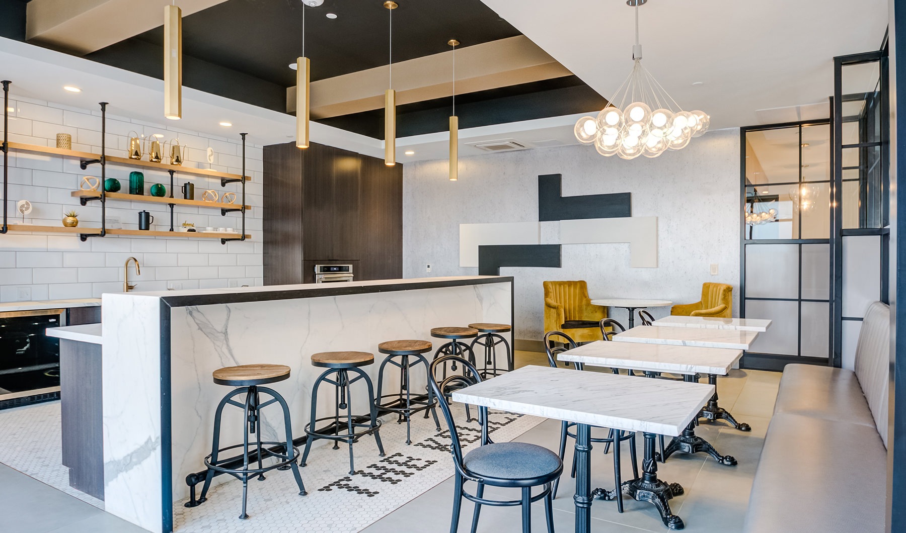 Large well lit community kitchen with cafe style seating